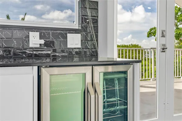 a bathroom with a granite countertop window and a sink