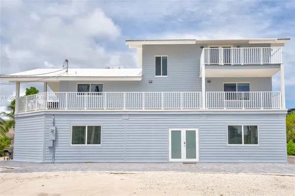 a view of a wooden deck with a table and chairs