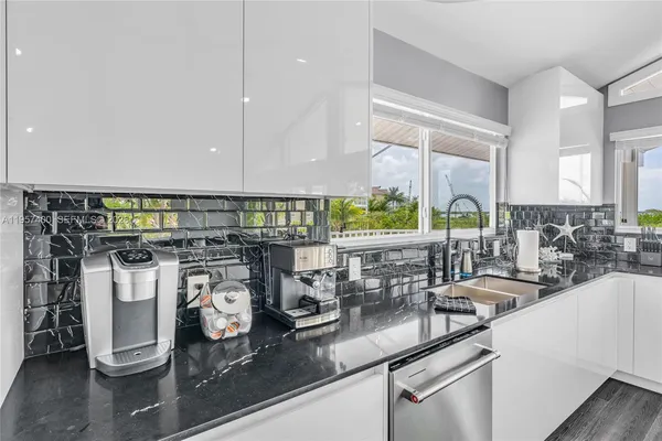 a kitchen with lots of counter top space and a window