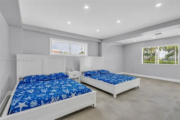 a bedroom with bed and a window