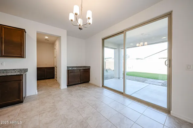 a view of an empty room with a fireplace
