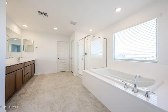 a bathroom with a granite countertop sink mirror and a