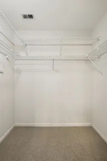 a view of an empty walk in closet