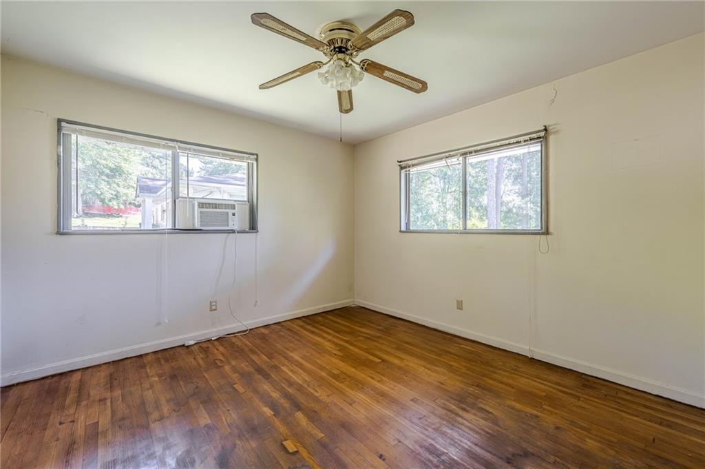 1502 North Druid Hills Road Brookhaven, GA 30319 - Photo 21 of 46 a view of empty room with wooden floor and fan