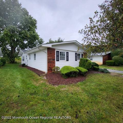 11 Markham Road Brick, NJ 08724 - Photo 1 of 17 a front view of house with yard and green space