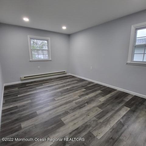 11 Markham Road Brick, NJ 08724 - Photo 13 of 17 an empty room with wooden floor and windows
