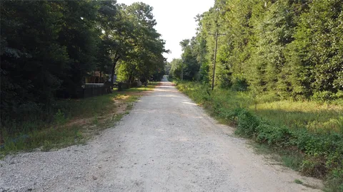 a view of a road with a yard