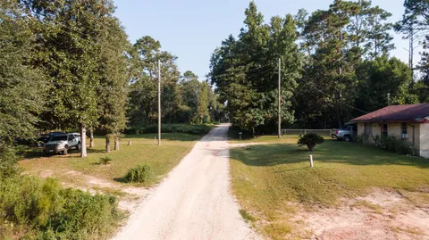 a view of a backyard with swimming pool