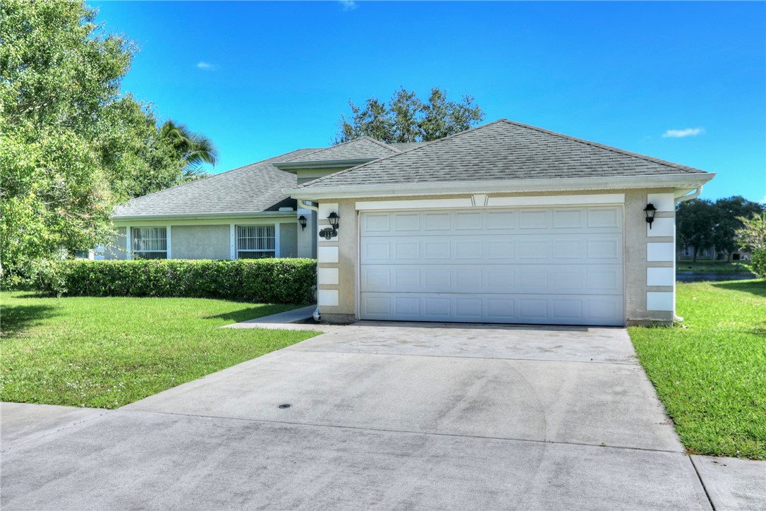 113 Drake Way Sebastian, FL 32958 - Photo 1 of 36 a front view of house with yard