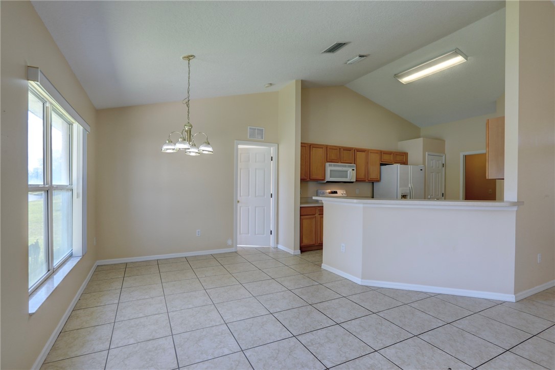 113 Drake Way Sebastian, FL 32958 - Photo 14 of 36 a view of a kitchen with electric appliances