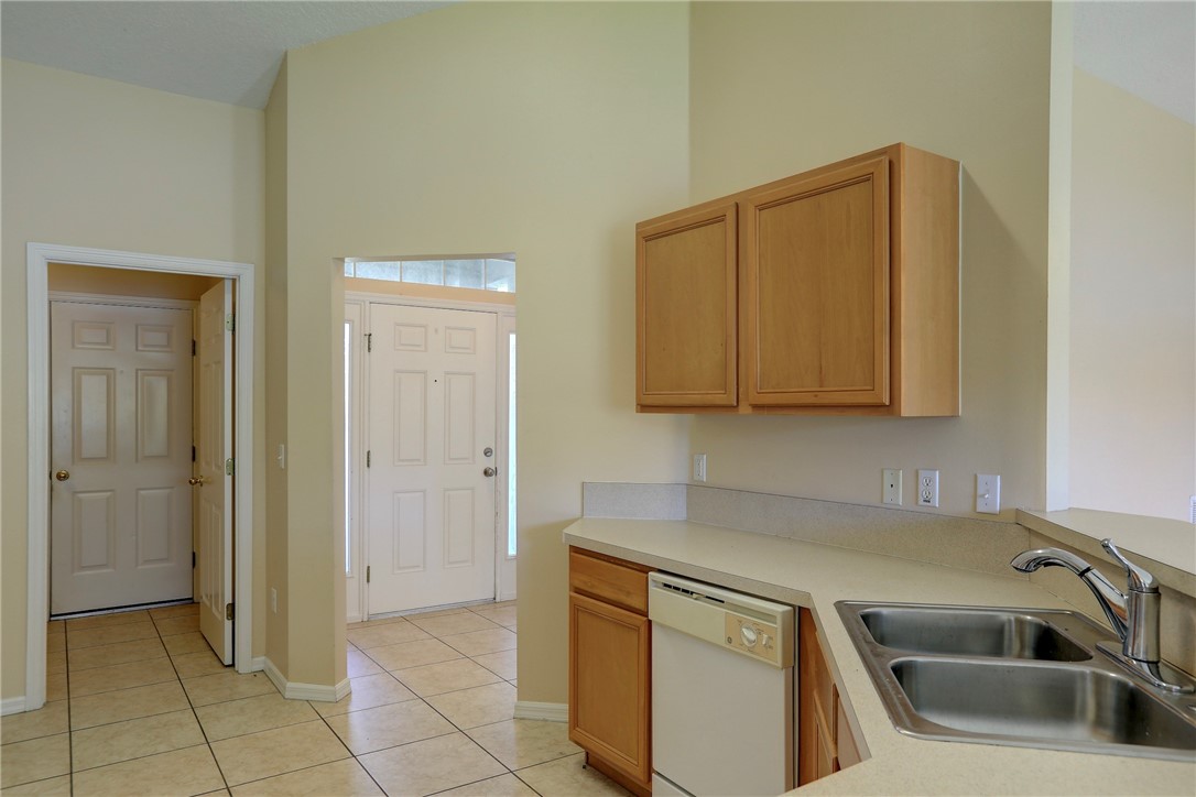 113 Drake Way Sebastian, FL 32958 - Photo 20 of 36 a kitchen with a sink and cabinets