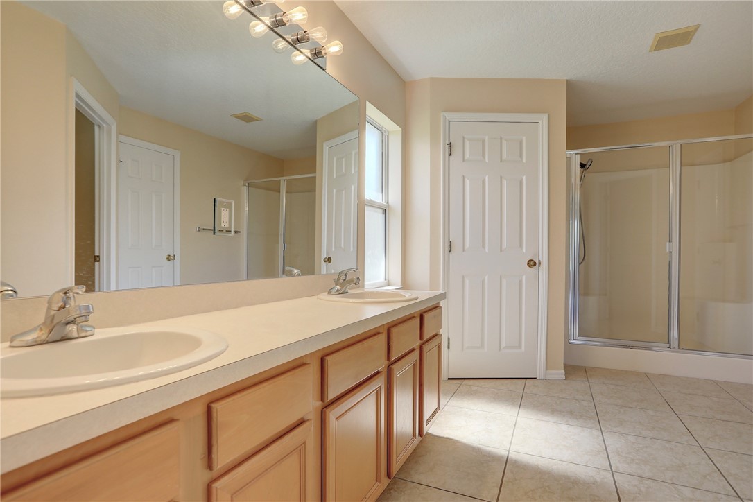 113 Drake Way Sebastian, FL 32958 - Photo 25 of 36 a bathroom with a sink and a mirror