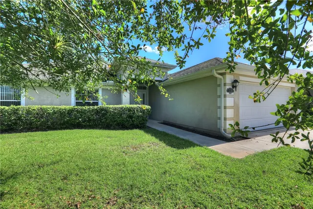 a view of backyard with a garden and trees