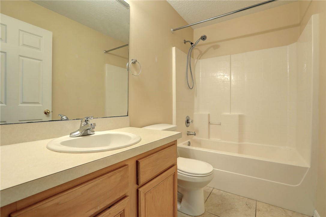 113 Drake Way Sebastian, FL 32958 - Photo 31 of 36 a bathroom with a sink a toilet and shower