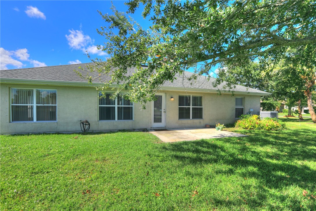 113 Drake Way Sebastian, FL 32958 - Photo 5 of 36 a front view of a house with a garden