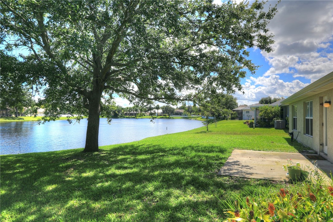113 Drake Way Sebastian, FL 32958 - Photo 6 of 36 a view of a lake with a garden
