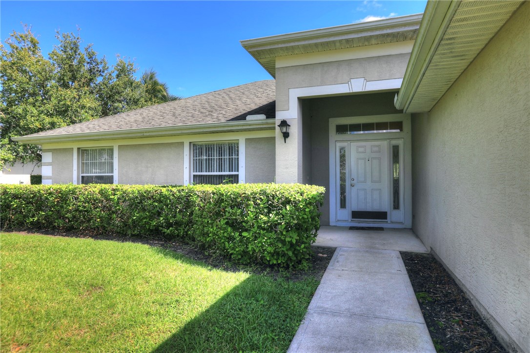 113 Drake Way Sebastian, FL 32958 - Photo 7 of 36 a front view of a house with a yard