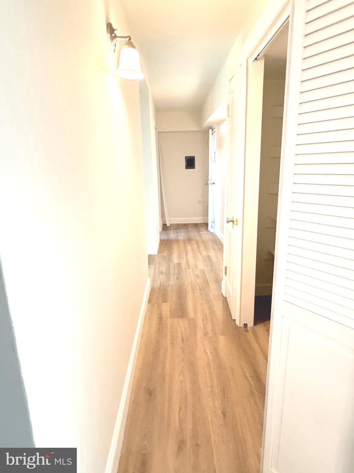 2316 Freetown Court, Unit 1B Reston, VA 20191 - Photo 17 of 36 a view of a bedroom with wooden floor and a bathroom