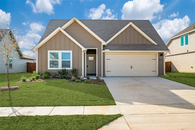 a view of a yard in front view of a house