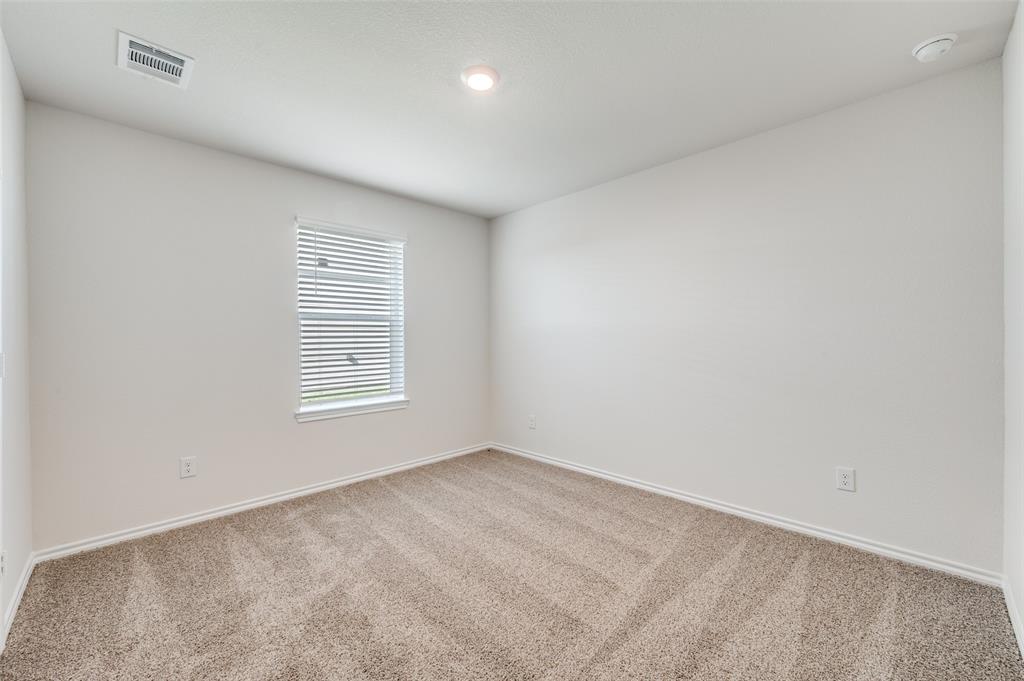 775 Tiger Lily Way Pilot Point, TX 76258 - Photo 11 of 13 an empty room with a window