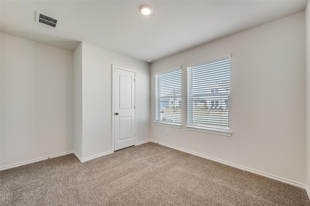 775 Tiger Lily Way Pilot Point, TX 76258 - Photo 12 of 13 a view of an empty room with a window