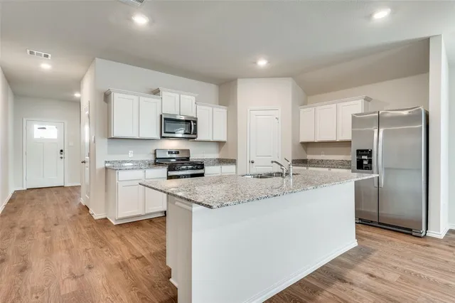 a view of kitchen with wooden floor