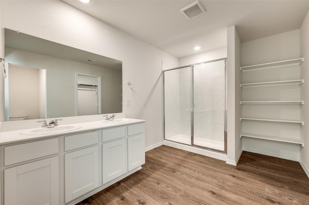 775 Tiger Lily Way Pilot Point, TX 76258 - Photo 9 of 13 a bathroom with a double vanity sink and mirror