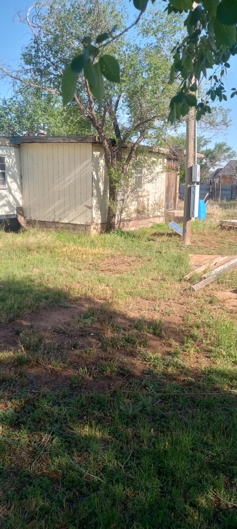 815 South 3rd Street Slaton, TX 79364 - Photo 4 of 9 a view of a yard with an outdoor space