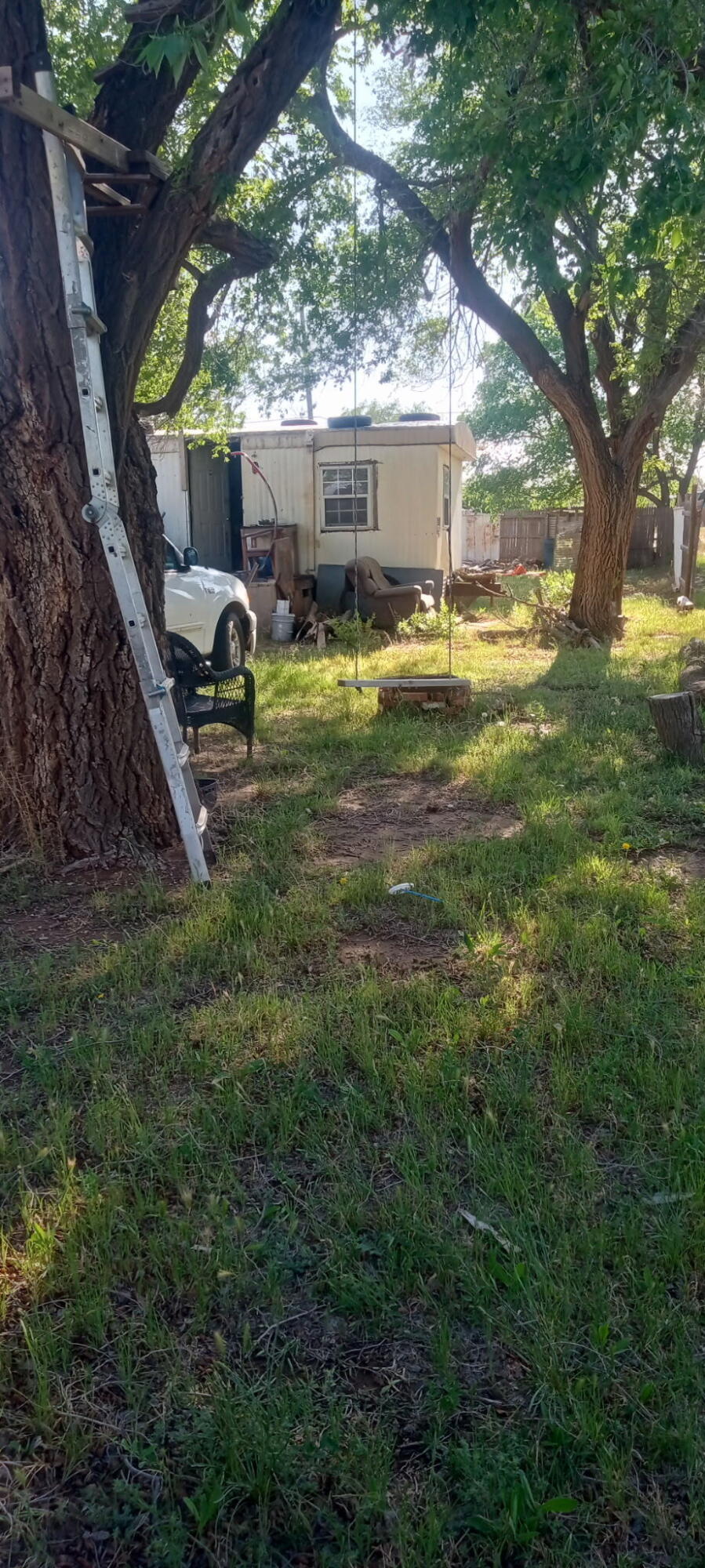 815 South 3rd Street Slaton, TX 79364 - Photo 5 of 9 a view of a house with backyard and sitting area