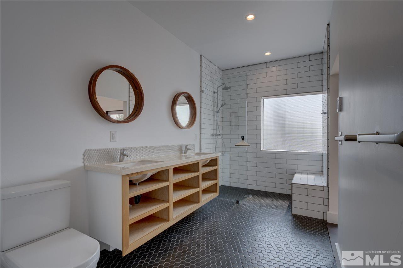525 Roberts Street Reno, NV 89502 - Photo 13 of 40 a bathroom with a double vanity sink and a mirror