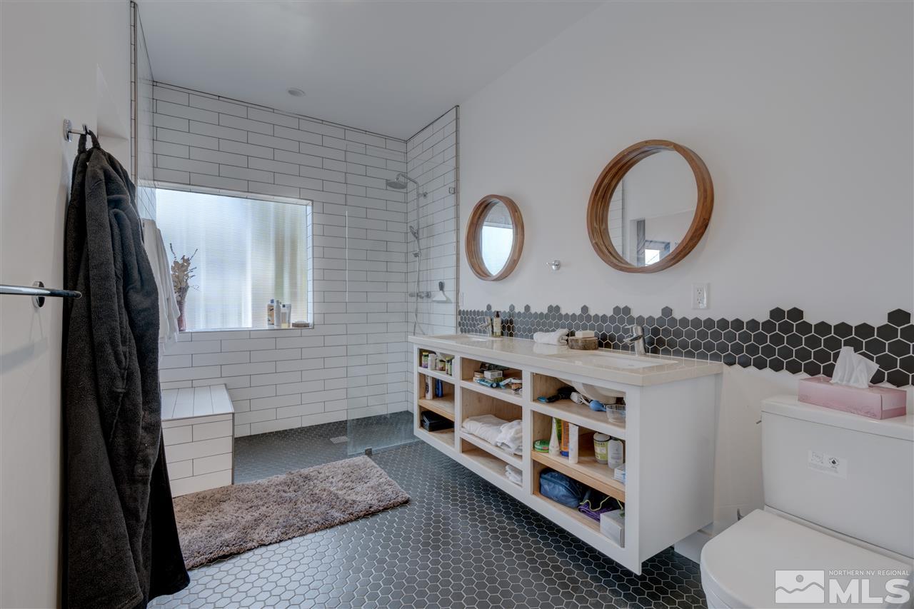 525 Roberts Street Reno, NV 89502 - Photo 34 of 40 a bathroom with a double vanity sink and a mirror