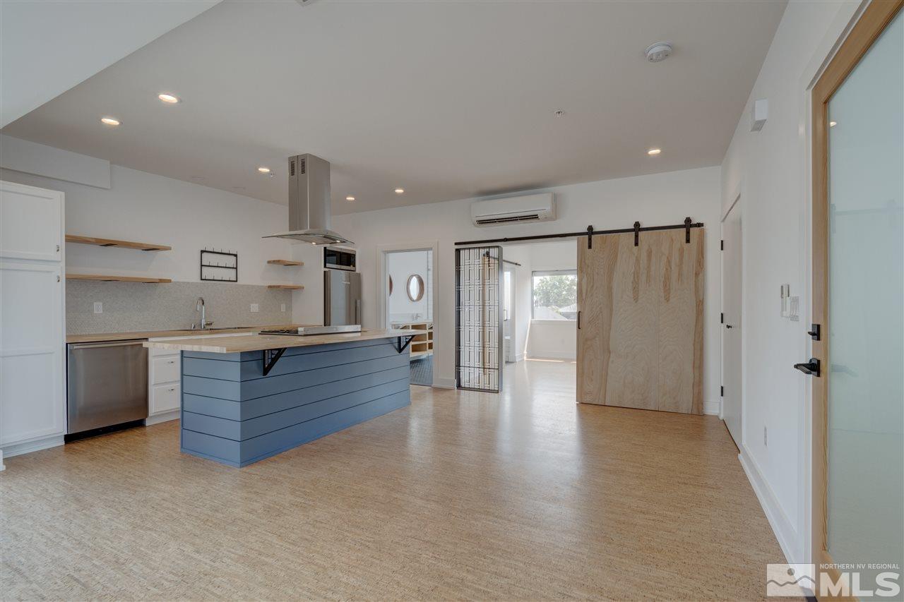 525 Roberts Street Reno, NV 89502 - Photo 5 of 40 a kitchen with a refrigerator and window