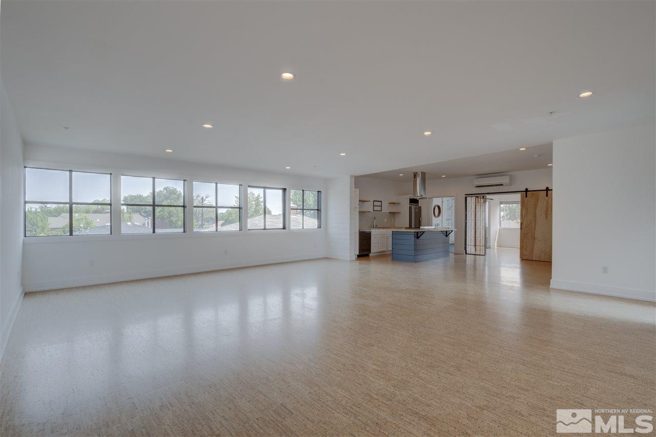 525 Roberts Street Reno, NV 89502 - Photo 6 of 40 a view of an empty room with a window and fireplace