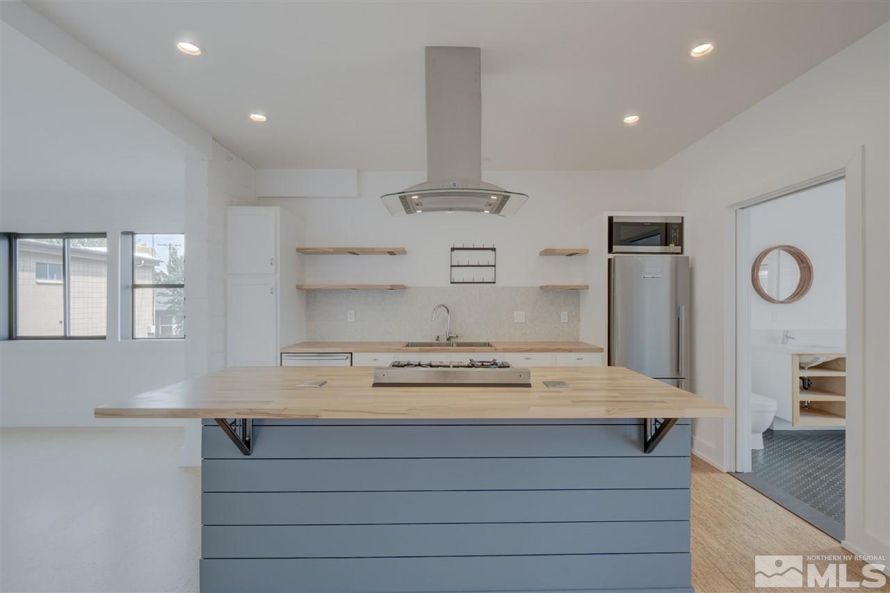 525 Roberts Street Reno, NV 89502 - Photo 9 of 40 a view of kitchen with center island and stainless steel appliances