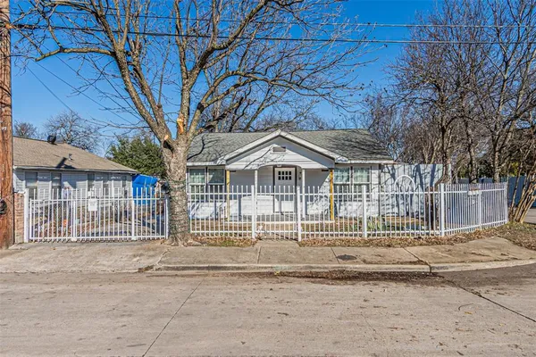 a front view of a house with a small yard