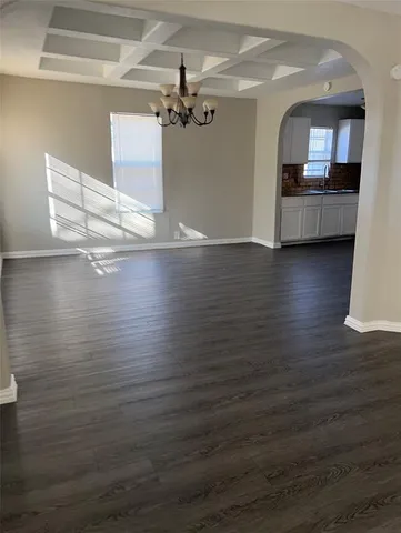 a view of a living room with hardwood floor