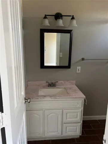 a bathroom with a toilet and bathtub