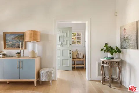 a room with furniture and a potted plant