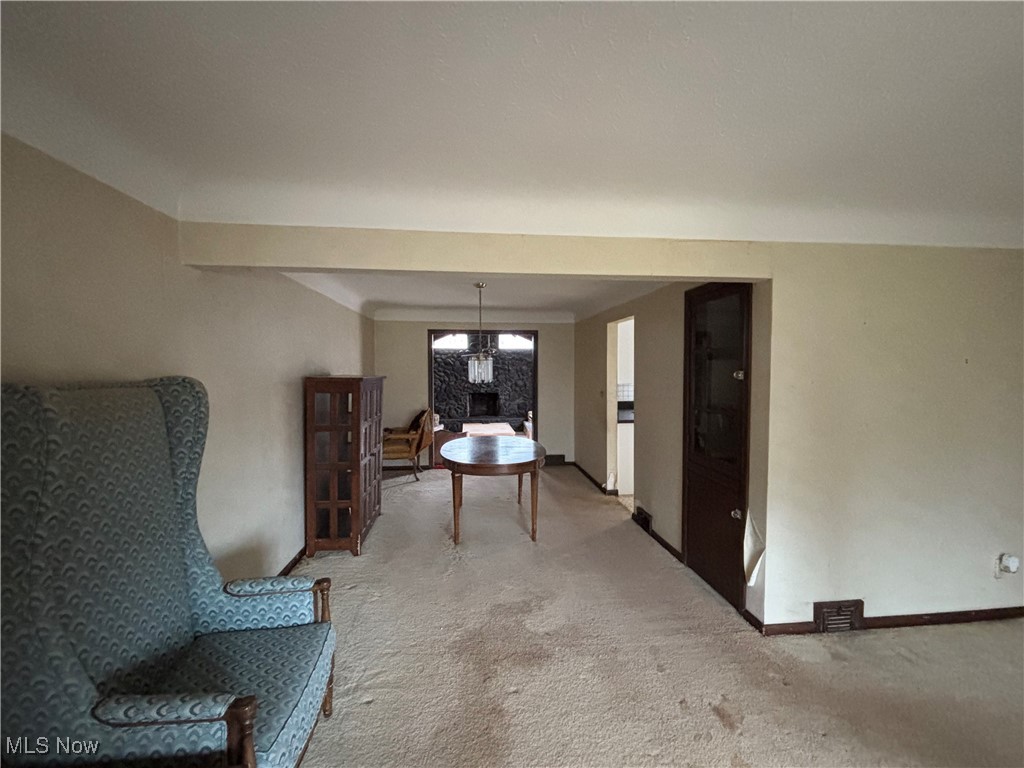 4308 Silsby Road University Heights, OH 44118 - Photo 6 of 28 Living area with carpet and an inviting chandelier