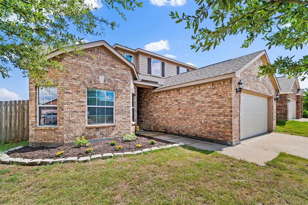 1100 Port Way Crowley, TX 76036 - Photo 3 of 31 a front view of a house with garden