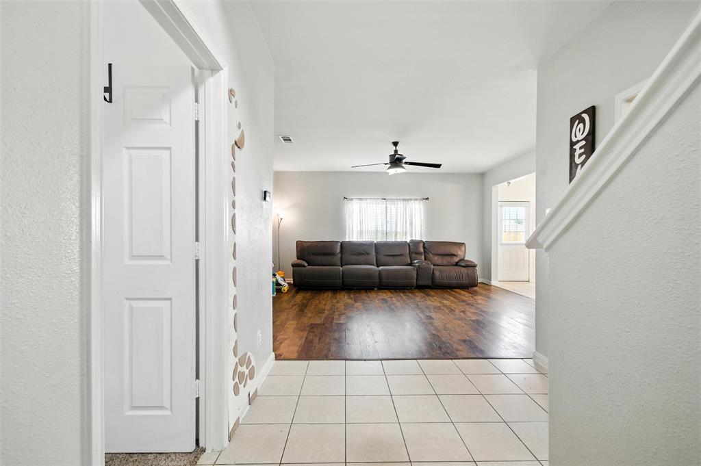 1100 Port Way Crowley, TX 76036 - Photo 9 of 31 a view of a livingroom with wooden floor and furniture