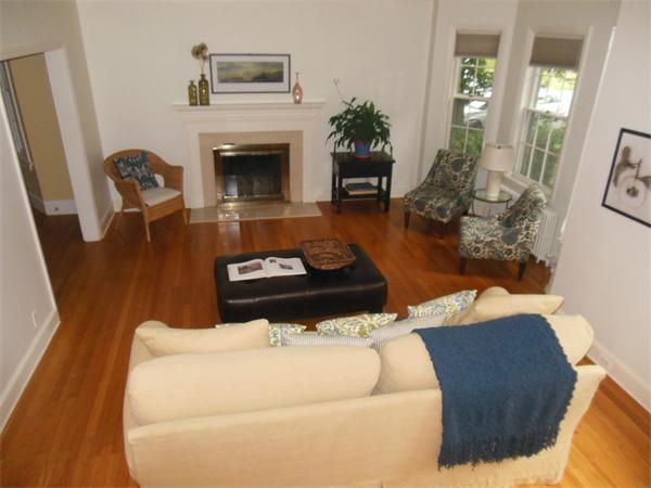 70 Ward Street Lexington, MA 02421 - Photo 2 of 12 a living room with furniture and a fireplace