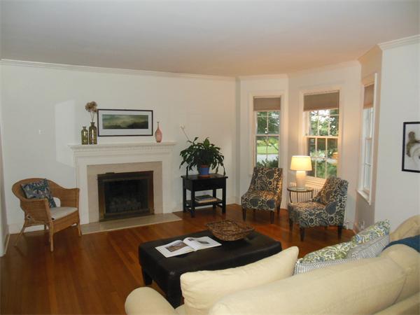 70 Ward Street Lexington, MA 02421 - Photo 3 of 12 a living room with furniture and a fireplace