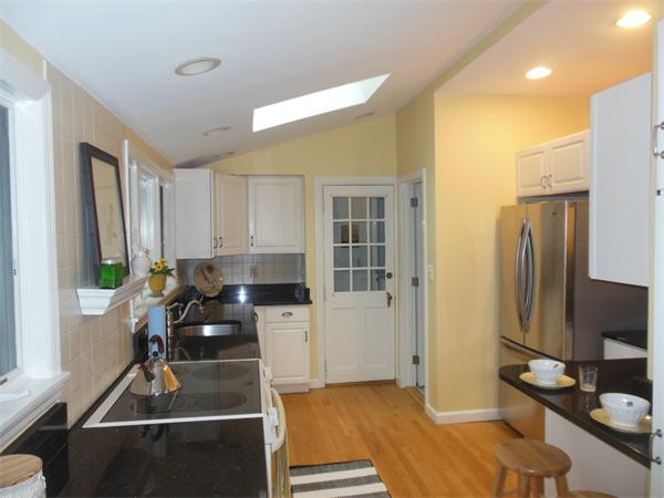 70 Ward Street Lexington, MA 02421 - Photo 10 of 12 a kitchen with a sink stove and refrigerator