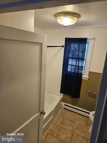 a bathroom with a toilet and a sink