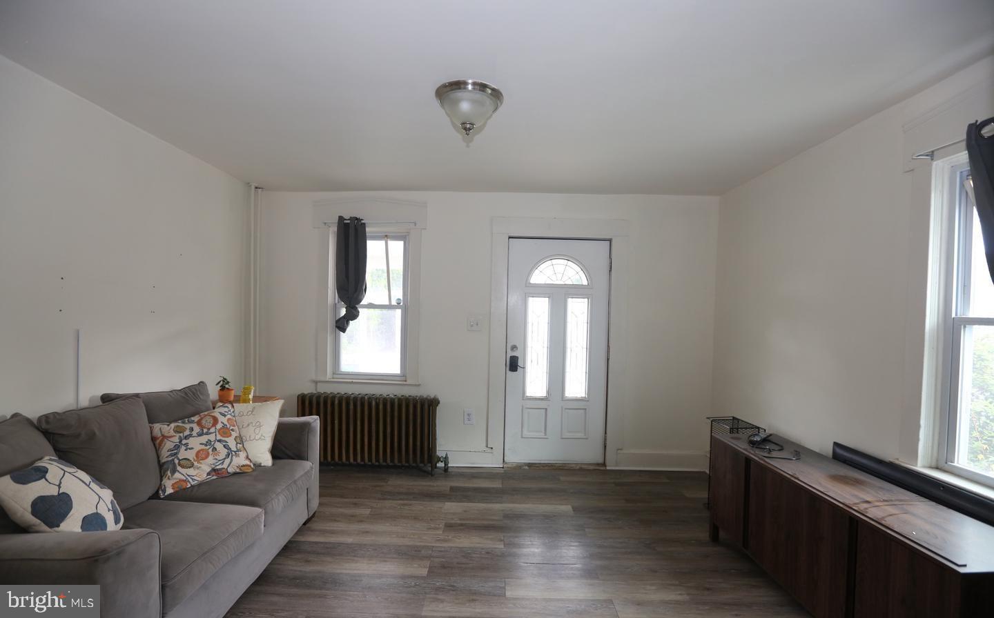 114 Ellis Street Glassboro, NJ 08028 - Photo 4 of 11 a living room with furniture and a window