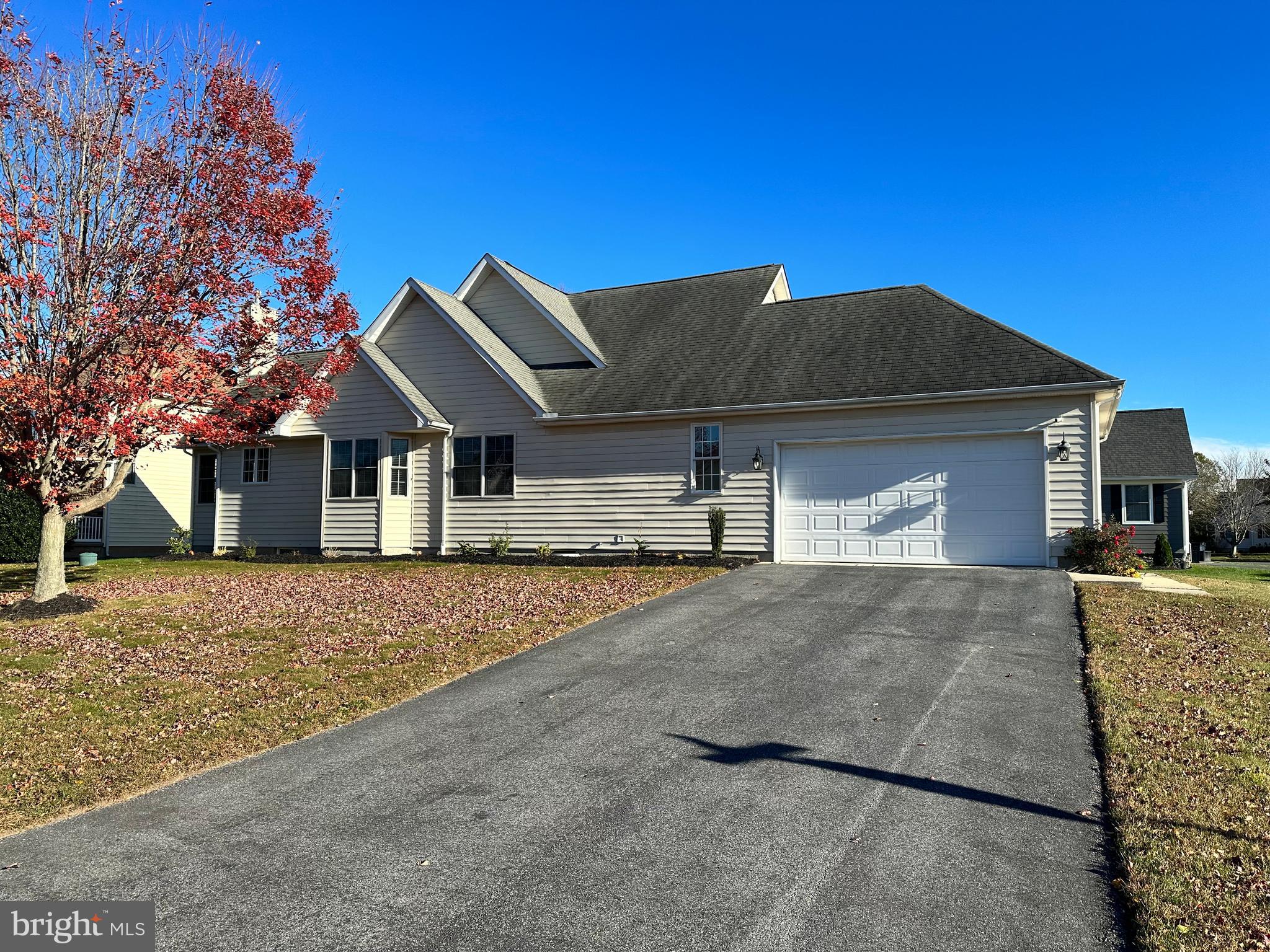 9 Kenmare Way Rehoboth Beach, DE 19971 - Photo 2 of 8 a front view of a house with a yard