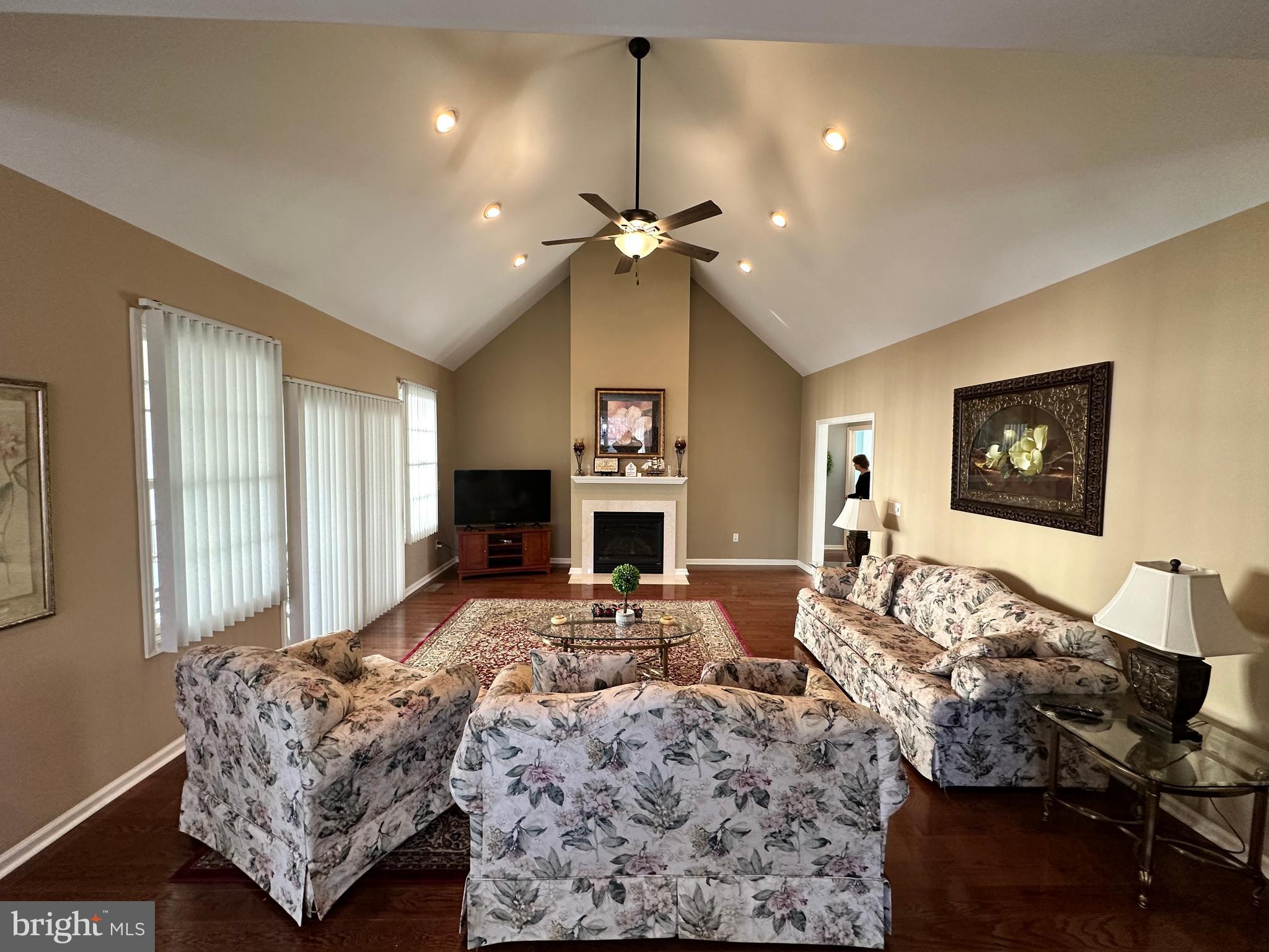 9 Kenmare Way Rehoboth Beach, DE 19971 - Photo 3 of 8 a living room with furniture chandelier and a large window