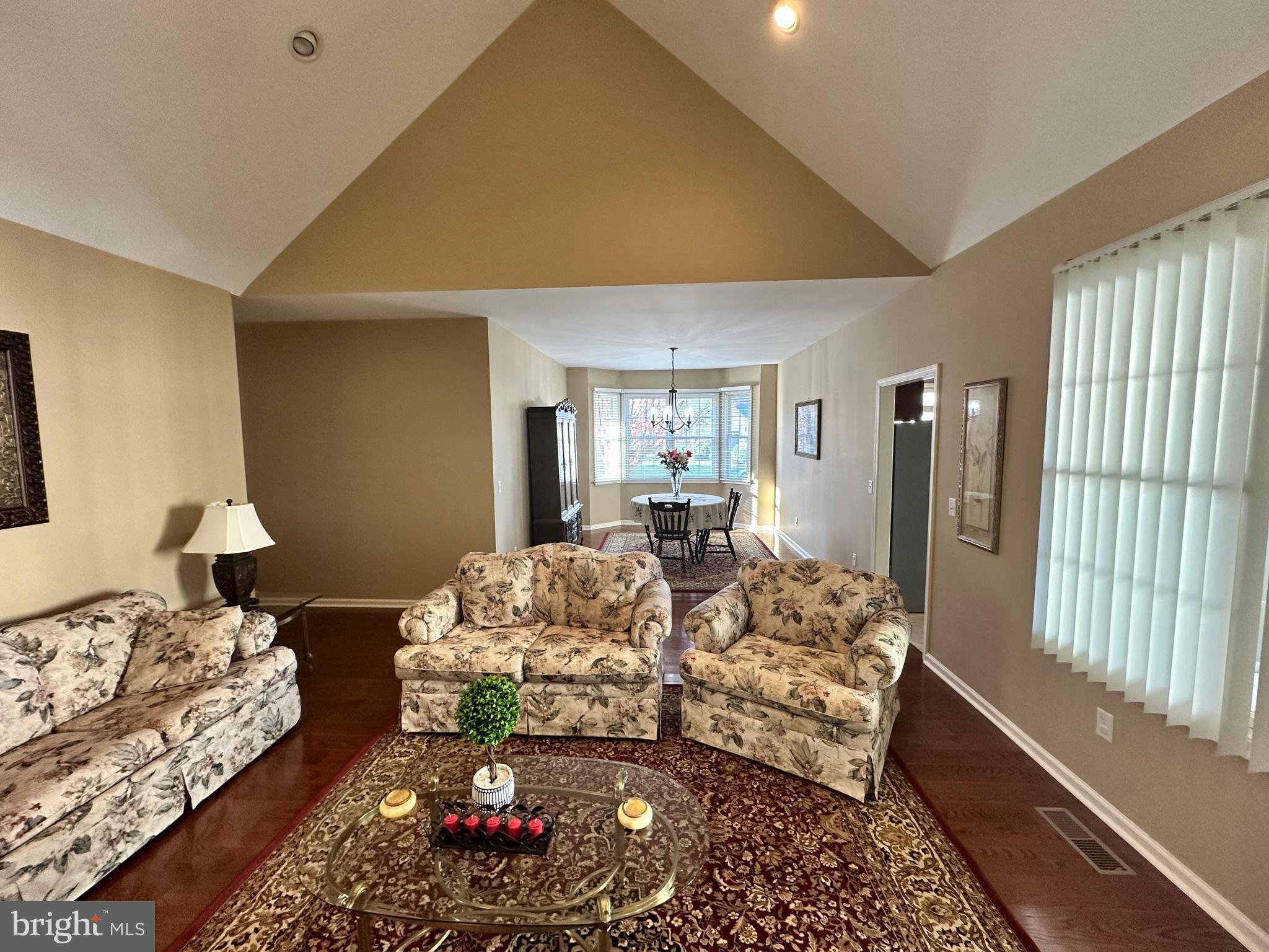9 Kenmare Way Rehoboth Beach, DE 19971 - Photo 4 of 8 a living room with furniture fireplace and large window