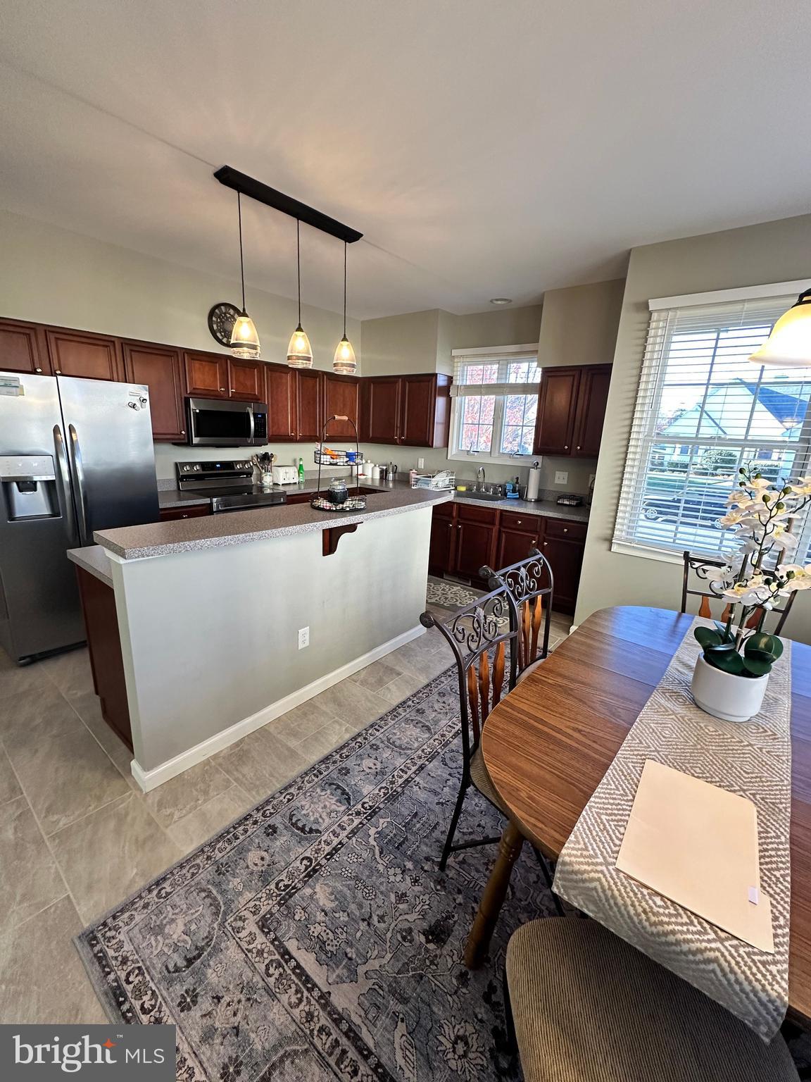 9 Kenmare Way Rehoboth Beach, DE 19971 - Photo 6 of 8 a living room with furniture and a wooden floor